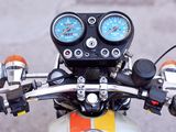 a close up view of a motorcycle handlebars and gauges