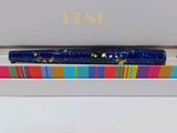 an open box with a pen and a pencil inside of it