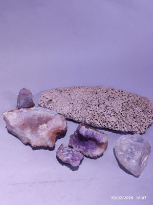 a large rock with a bunch of rocks on top of it