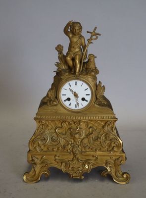 PENDULE en bronze doré À décor d'un Saint Jean-Baptiste enfa…