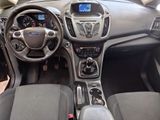 the interior of a car with a steering wheel, dashboard, and dashboard controls