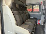 four seats in the back of a van with a can of soda