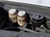 a close up of a car ' s engine with the hood open