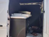 a white van with a microwave inside of it