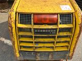 a large yellow machine that is parked in the parking lot