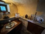 an image of a room with a table and a window