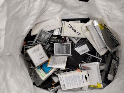 a bag full of electronic devices that are in the trash