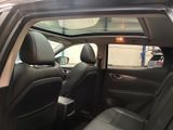 a view of the inside of a car from the passenger seat