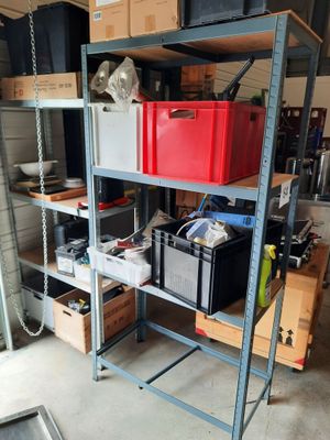 many boxes and boxes on the shelves in the garage