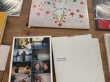 a table with a bunch of books and pictures on it