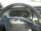 dashboard of a car with a steering wheel and a dash light