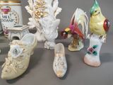 many different types of ceramic figurines on the table