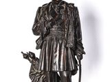 bronze statue of a man with a dog on a white background