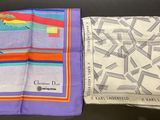 two different colored handkerchiefs on a table with a black background