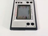a close up of a small electronic device on a white surface