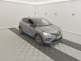 the grey car is parked in the garage on the checkered floor