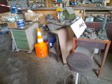 an image of a workbench in a garage with a lot of clutter