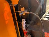 an image of a machine that is working on a piece of machinery