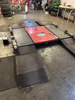 a garage with a lot of tires on the floor