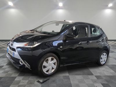 a picture of a black toyota yaris parked in a garage