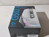 the box of a computer mouse is sitting on a table