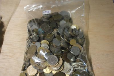 a bag full of coins sitting on a table
