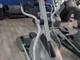 a row of stationary exercise bikes in a gym