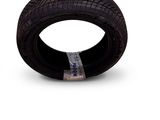 a tire that is sitting on top of a white surface
