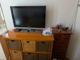 an image of a bedroom with a television and a bed