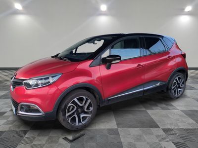 a red renault c - cross suv parked on a checkered floor