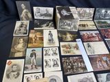 a lot of old photographs on the table together