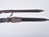 two knives that have been left on the table