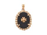 un pendentif en pierre dorée et noire orné d'une fleur