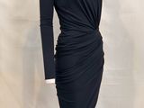 the dress is black and has long sleeves on it