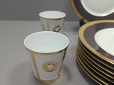 a lot of plates and cups on the table