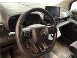 the interior of a car with a steering wheel, dashboard and dashboard controls