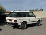 a white car that is parked in a parking lot