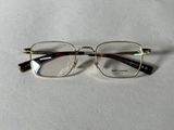 an image of a pair of glasses sitting on top of a table