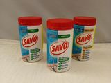 three bottles of savo cleaner sitting on a counter top