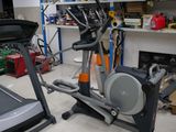a gym room with a treadie and a treadie machine