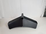 a close up of the corner of a desk with a laptop on it