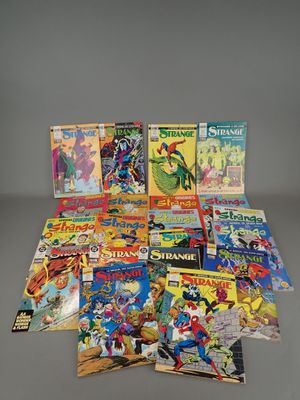 a pile of comic books sitting on top of a table