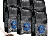 four bags of freshland coffee with a spoon next to them
