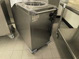 a machine that is sitting in the middle of a kitchen