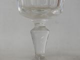 a glass cup that is sitting on a table