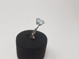 an image of a diamond ring sitting on top of a black box