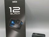 an image of a black gopro camera next to a box of its packaging