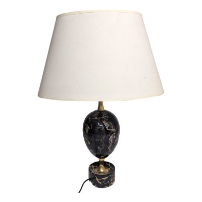 a black marble lamp with a white shade on a white background