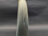 a picture of a white vase on a gray background