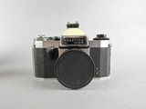 a black and white photo of a camera and a silver and black camera